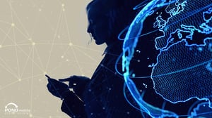 Silhouette using a smartphone with a digital globe overlay