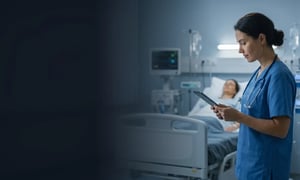 Healthcare professional using a connected tablet in a hospital environment.