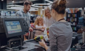 Retail checkout with POS terminal and customer payment