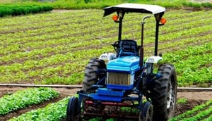 Tractor working in a farm field
