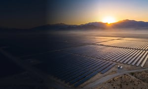 Utility-scale solar farm at sunrise