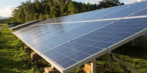 Solar panels installed outdoors on a grassy field